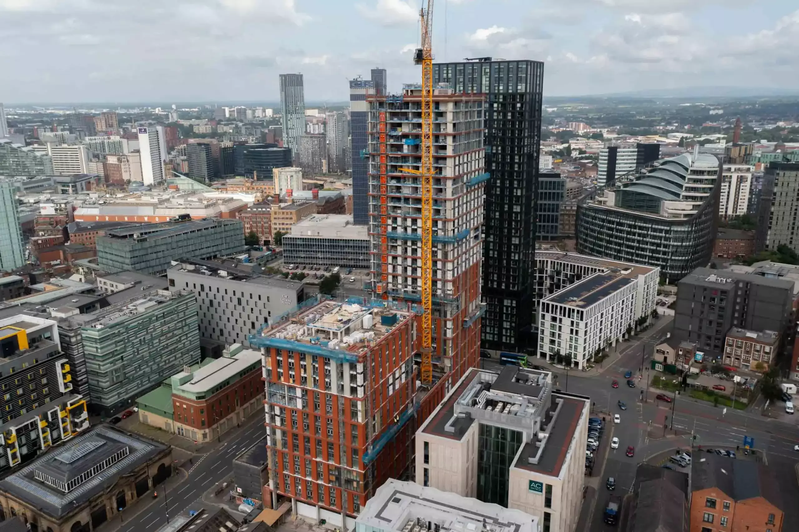 Aerial filming of tall tower block construction project in Manchester