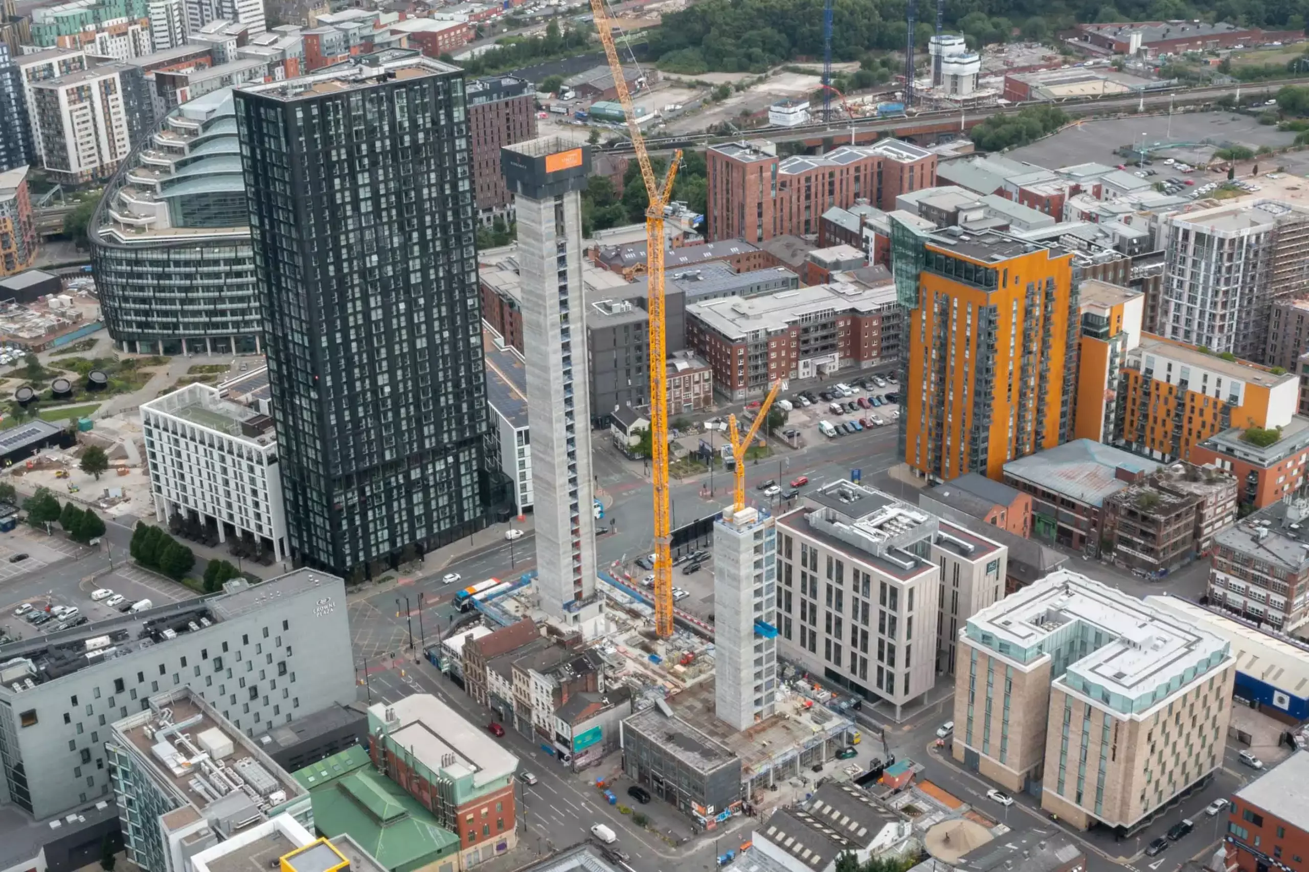 Aerial drone progress reporting of a tower block being built in Manchester during early stages